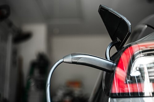 Electric Vehicle Charging Cable Plugged In